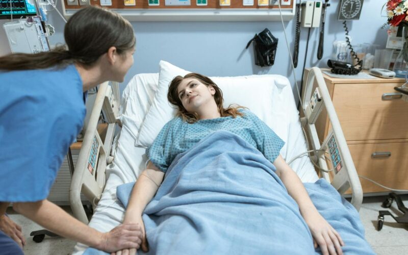 A nurse taking care of a woman