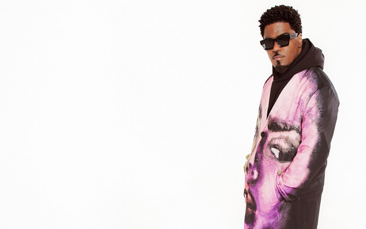 Glen Lewis in pink printed coat