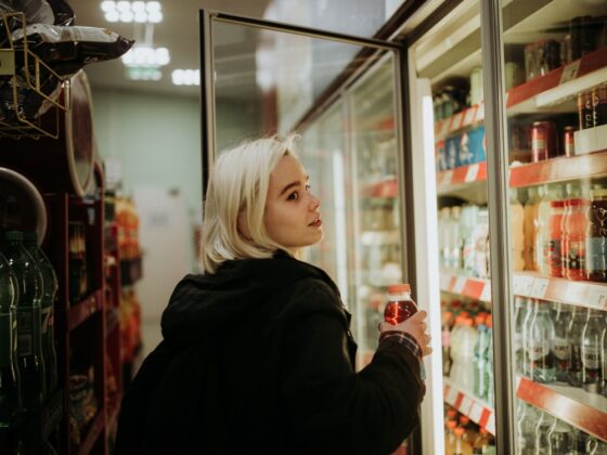 A woman buying an energy drink